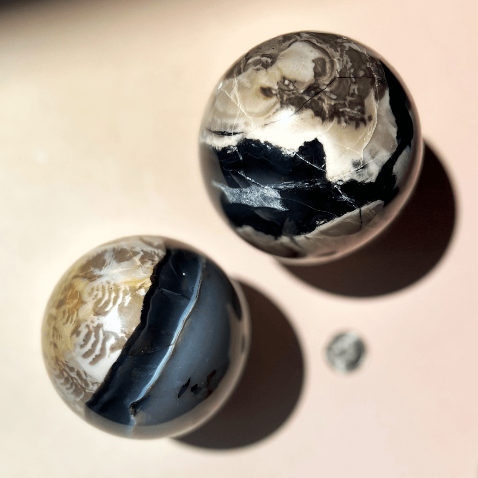 Volcano agate sphere used for grounding energy with natural layered patterns and earthy tones
