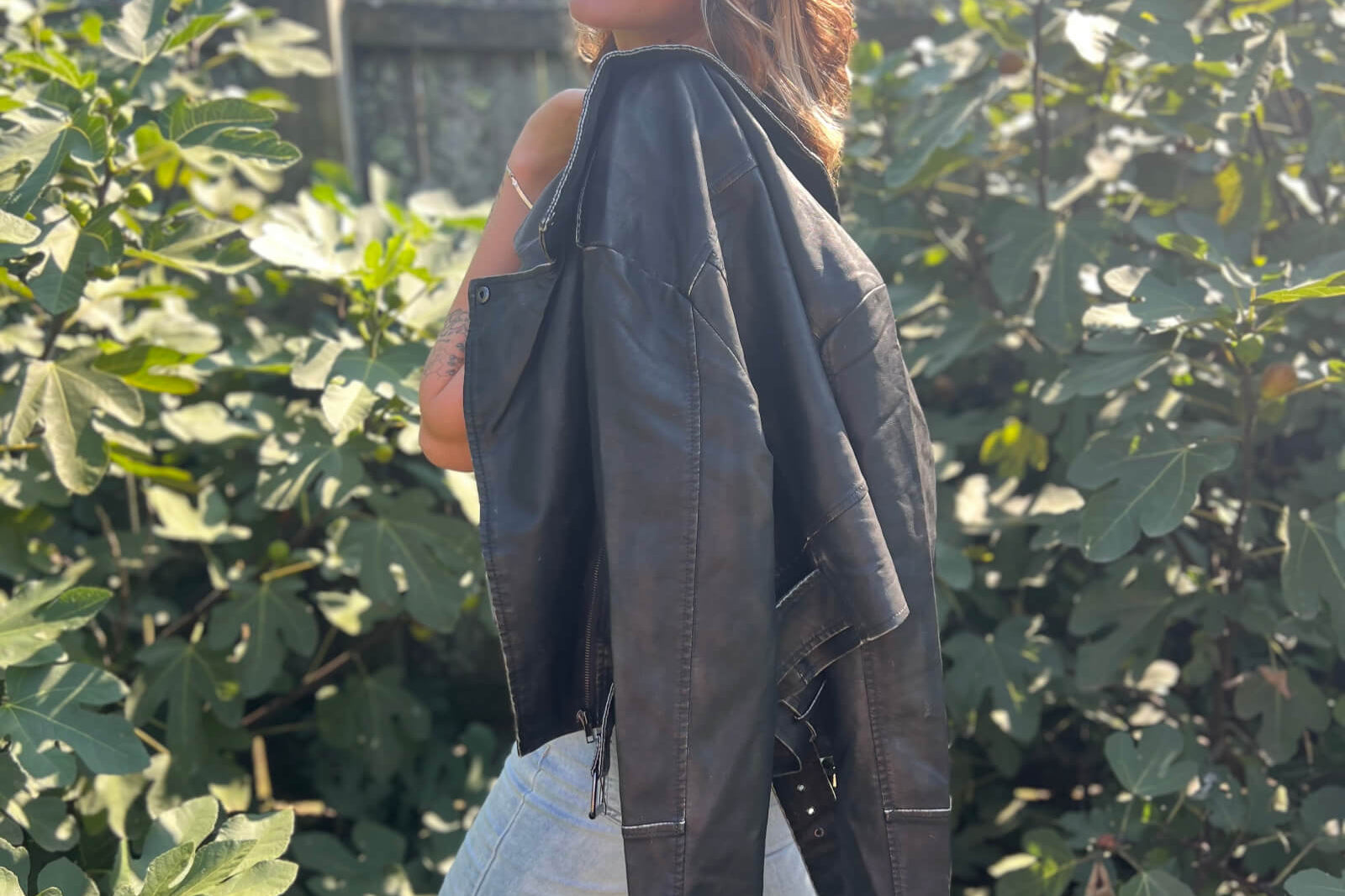 Women wearing a variety of jackets including leather jackets, bomber jackets, trench coats, and colorful outerwear
