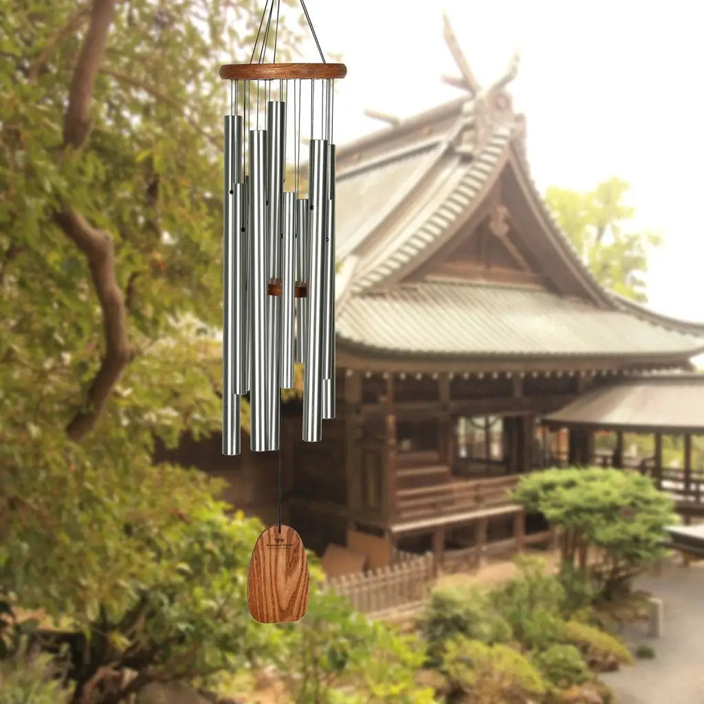 The Magical Mystery Chimes in front of an outdoor cottage background.