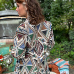 Fashion pose featuring hippie boho long unisex trench coat