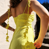 Yellow dress for women styled in boho summer outfit